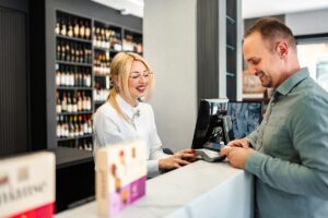 customer-paying-at-a-liquor-store-checkout