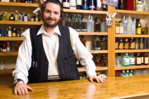 liquor-store-owner-behind-the-counter