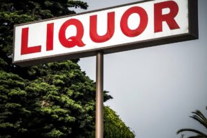 red-liquor-sign-on-a-pole