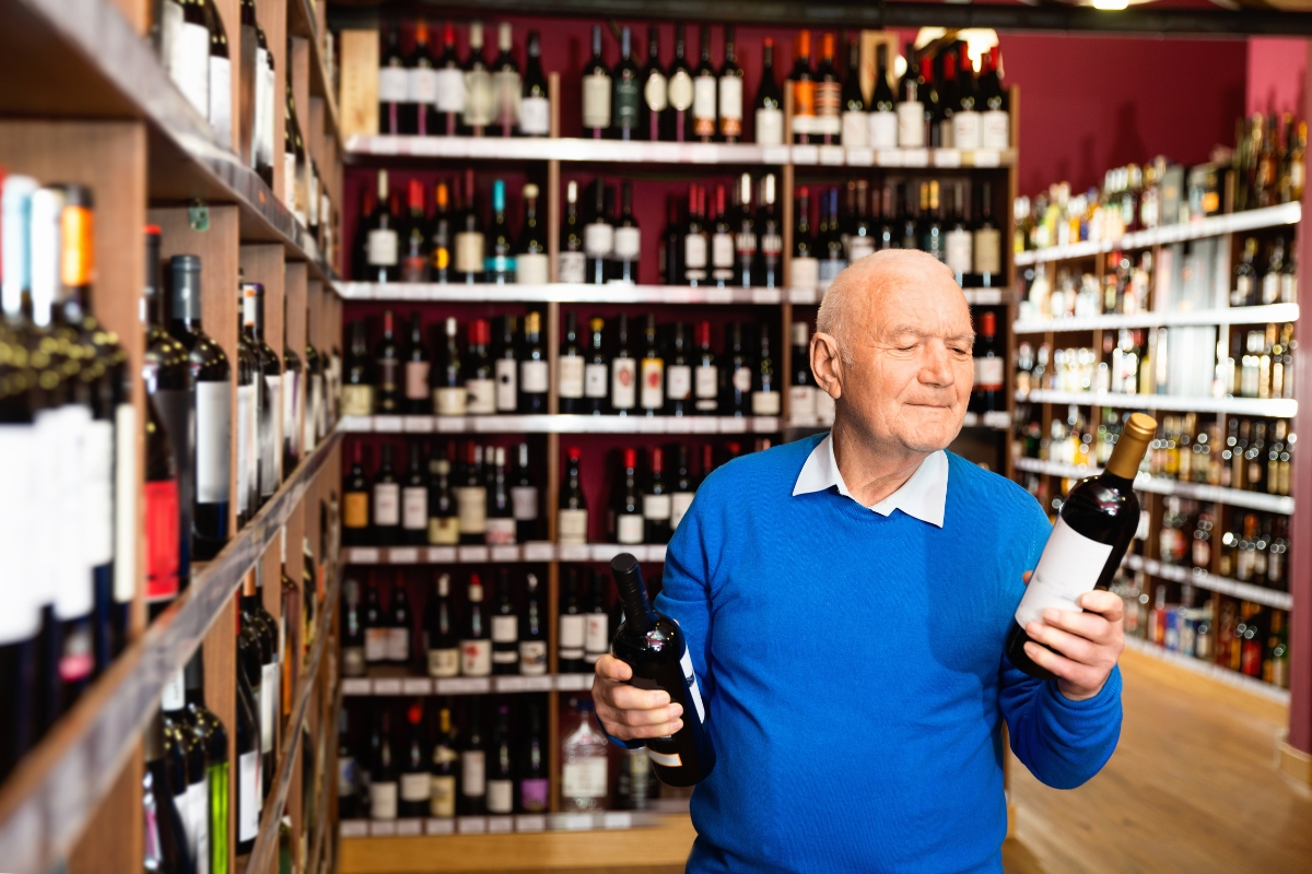 senior-customer-comparing-wines