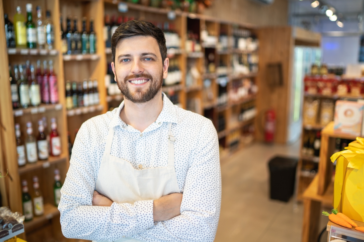 smiling-shop-owner-in-his-store