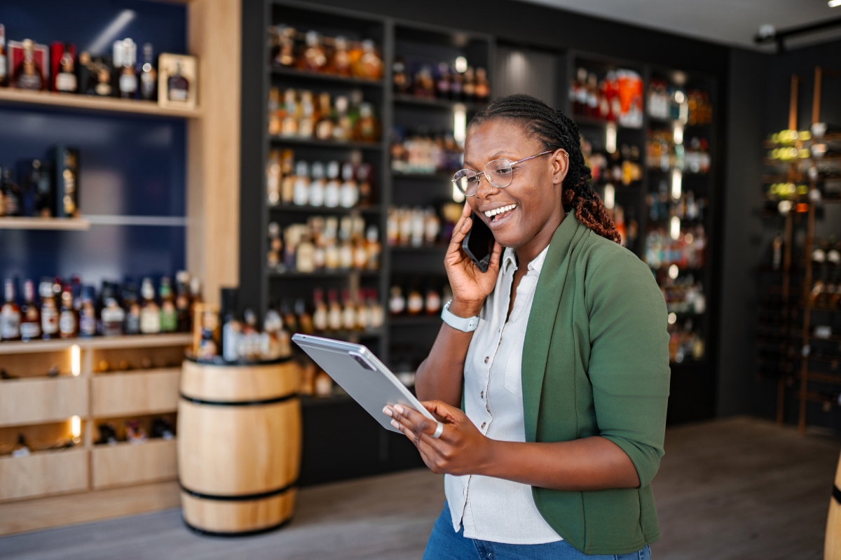 store-manager-on-the-phone-with-a-tablet